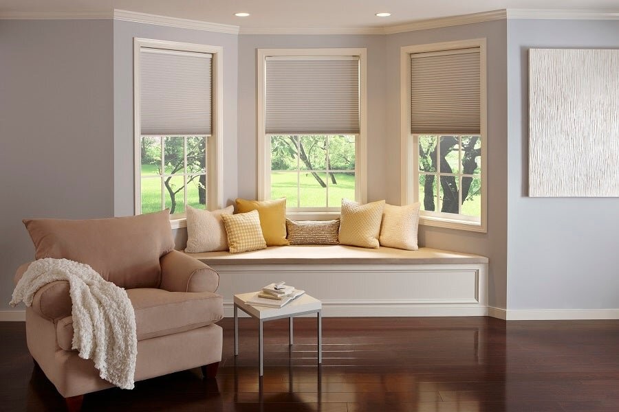 A living space featuring motorized blinds from Lutron.
